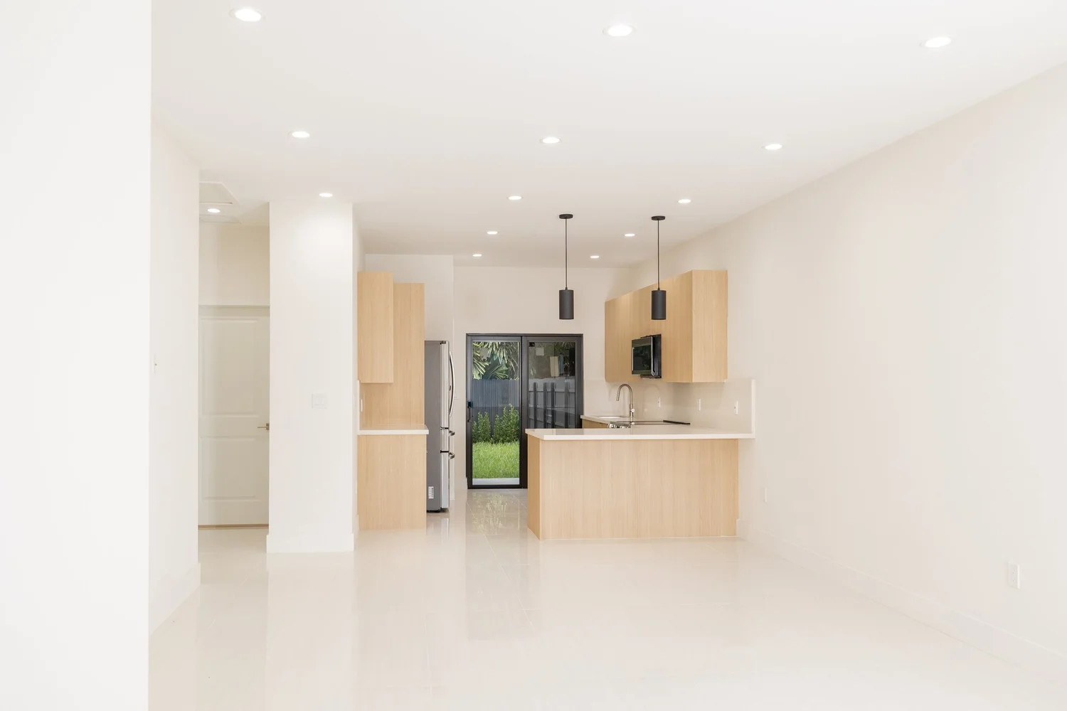 Open-plan kitchen and living space in a new-construction home built by ARK Group Construction