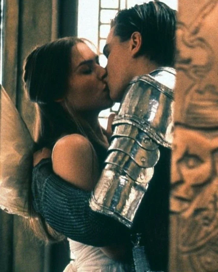 A knight and an angel sharing a kiss