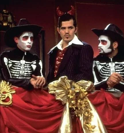 Theatrical skeleton and devil costumes