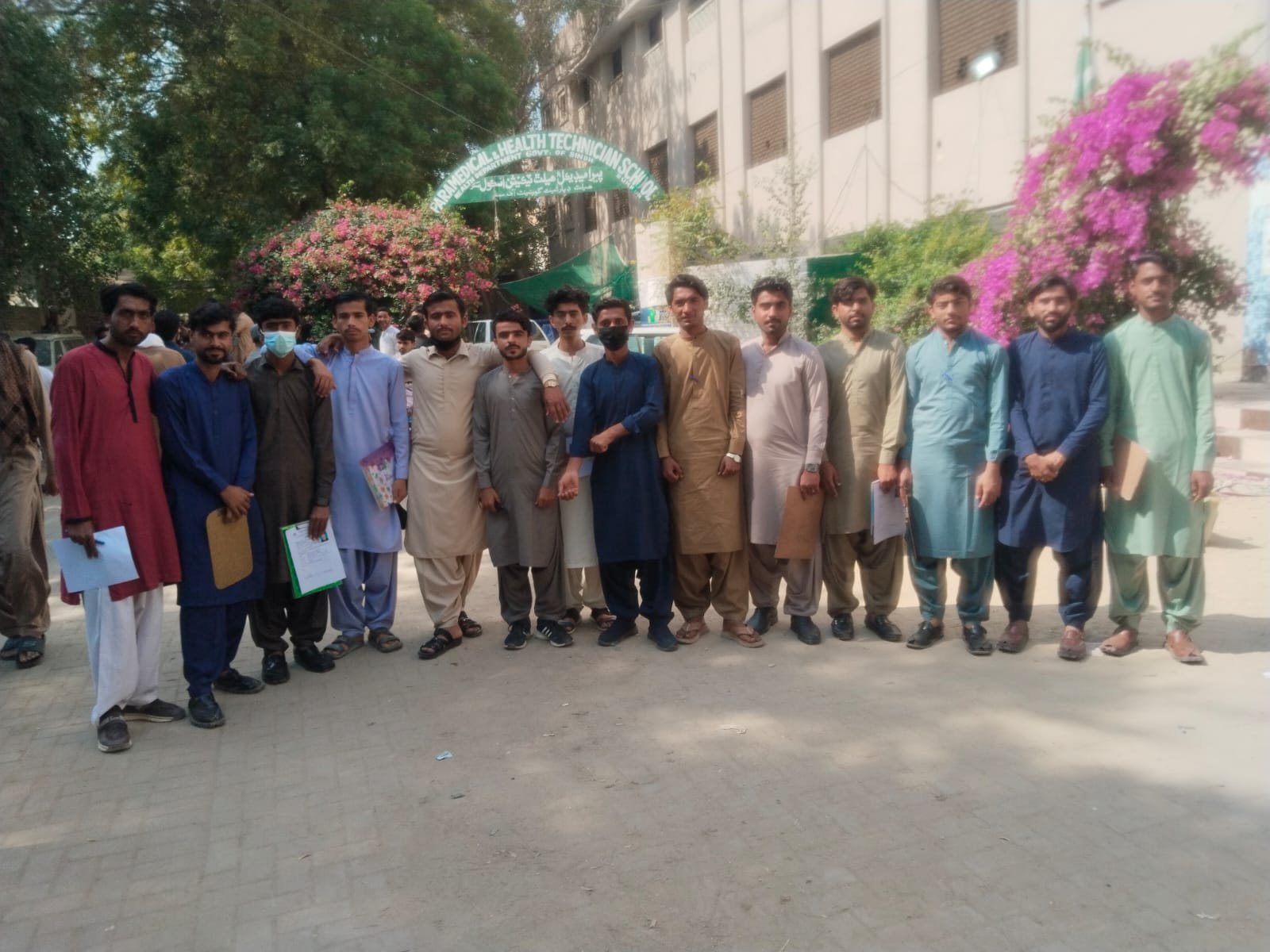 Students from the Jeejal Pari Institute stand together outside their training school in Sindh