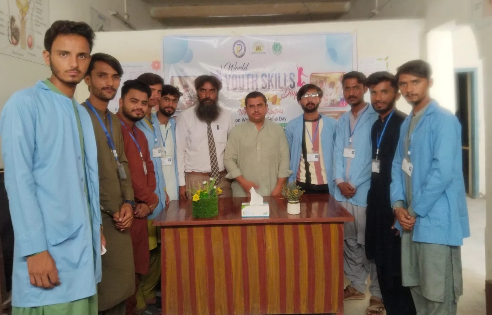 Students and staff of the Jeejal Pari Institute gather together during World Youth Skills Day