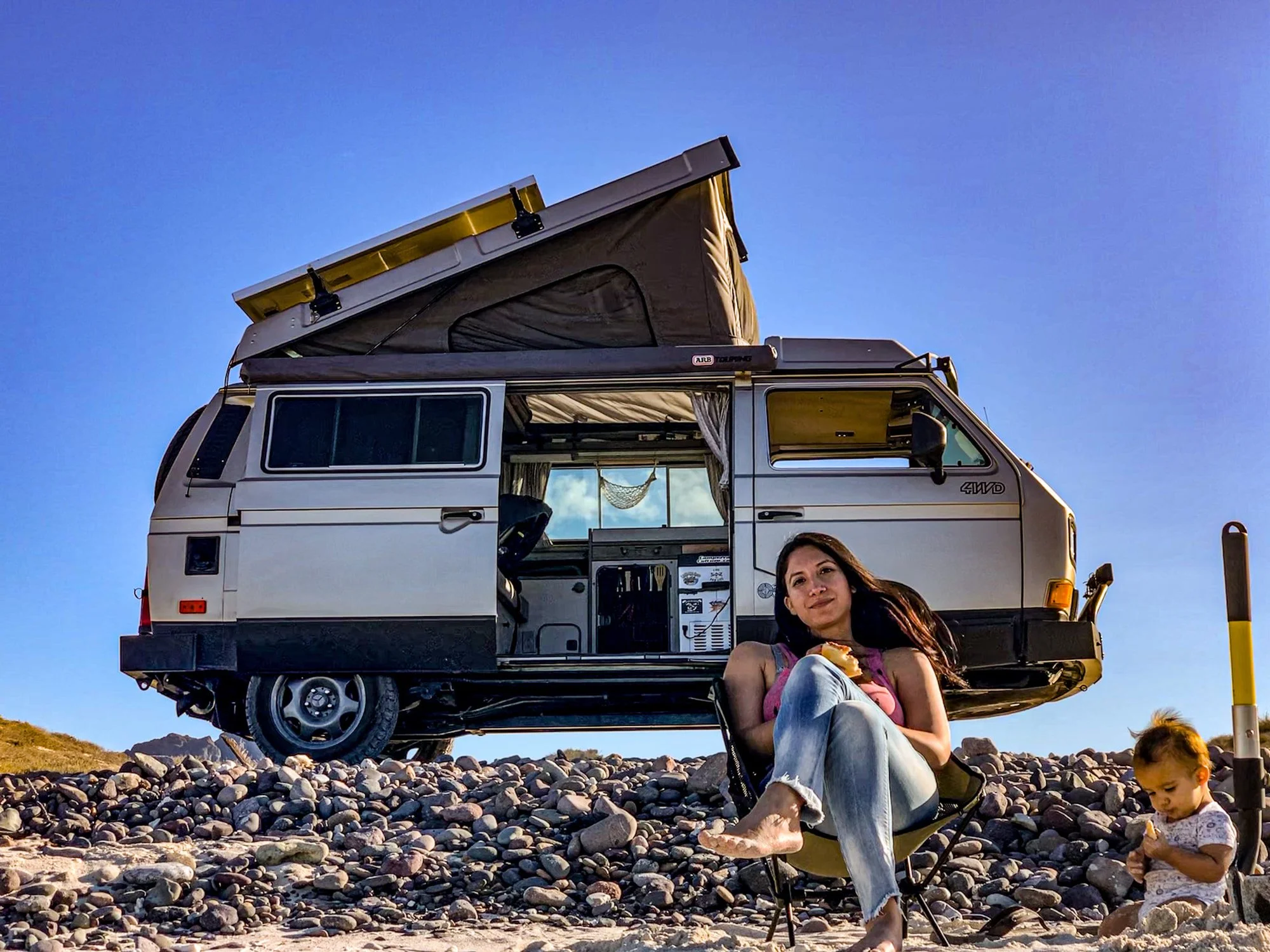 Miki, ready to camp — LiveTheVanLife’s 1991 Syncro Westfalia with its pop-top raised. Explore Miki’s build story.