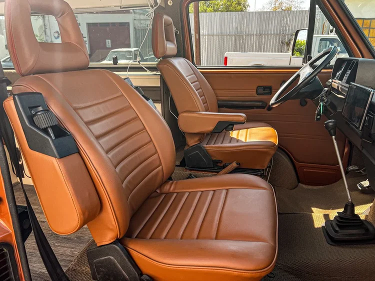 Warm brown upholstery with coordinated front seats and trim.