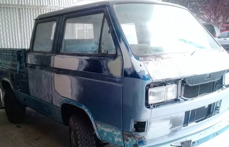 Front quarter of a Volkswagen double-cab pickup with sanded body panels