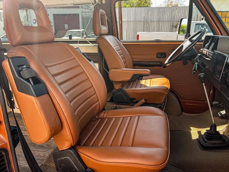 Brown upholstered Volkswagen van seats and matching door trim