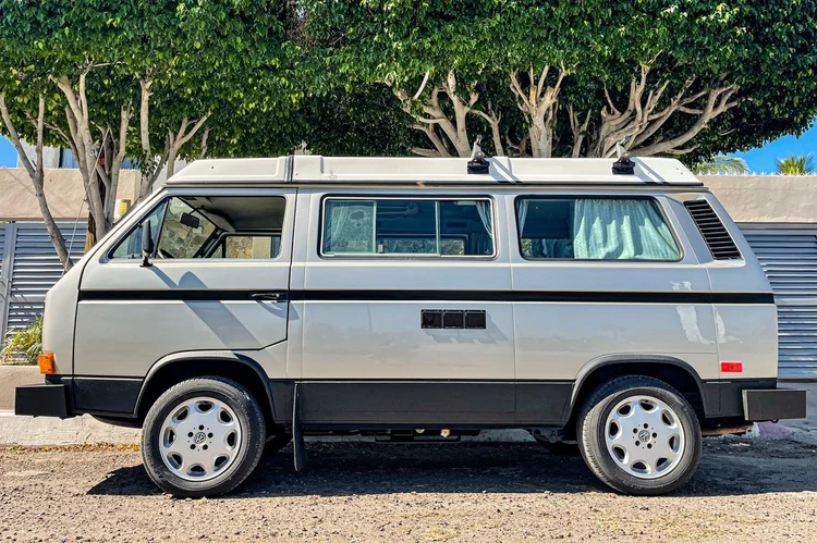 Silver Volkswagen Westfalia parked in profile