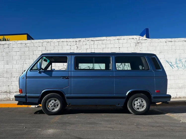 Blue Volkswagen Vanagon parked in profile