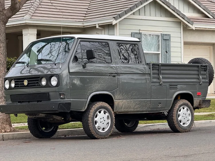 Gray Volkswagen double-cab pickup with a rear-mounted spare tire