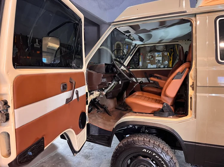 Volkswagen camper cab with brown seats and two-tone door trim