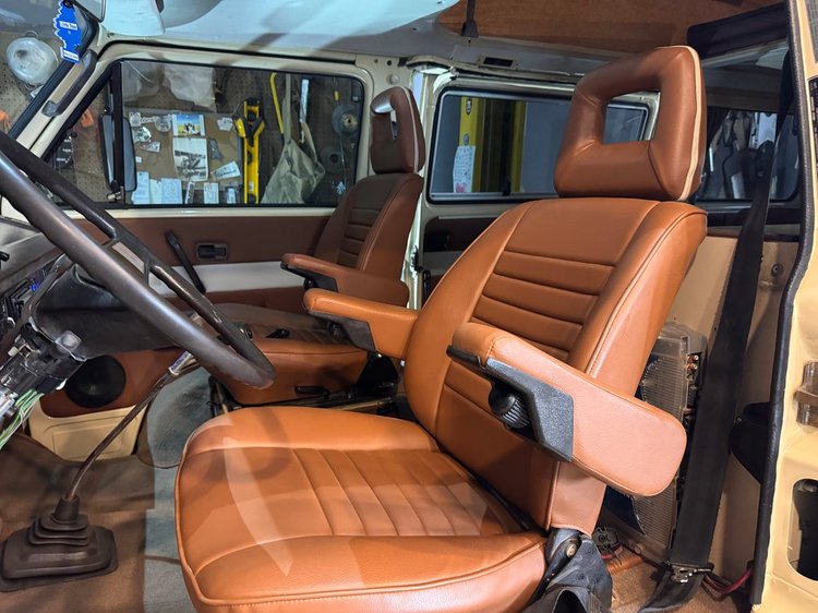 Brown upholstered Volkswagen van front seats