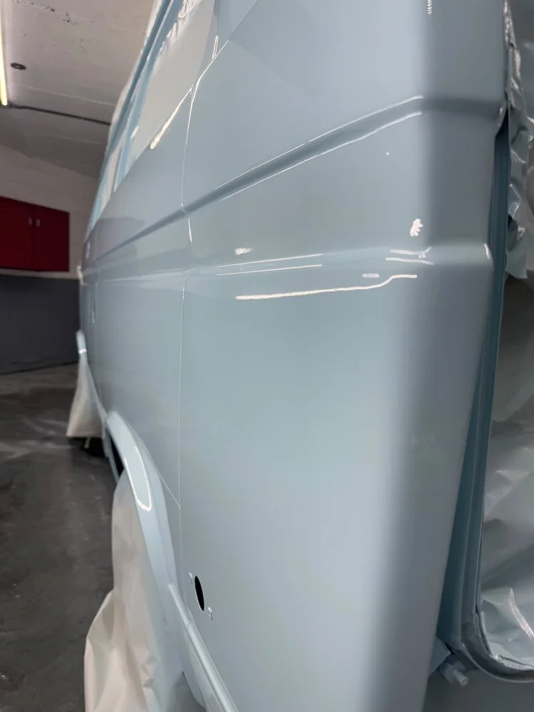 Close-up of a light blue Volkswagen rear body panel