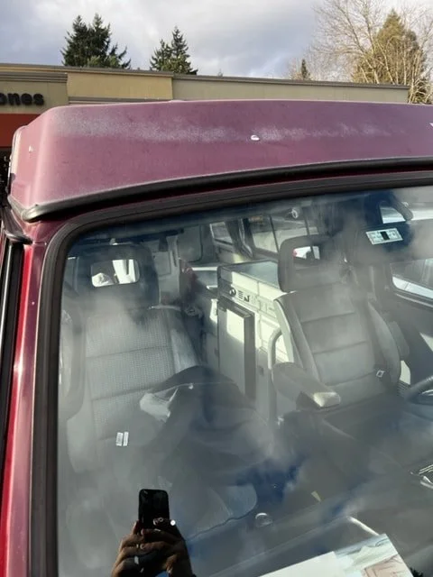 Burgundy Volkswagen windshield surround and roof edge