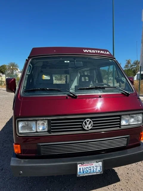 Front view of a burgundy Volkswagen Westfalia