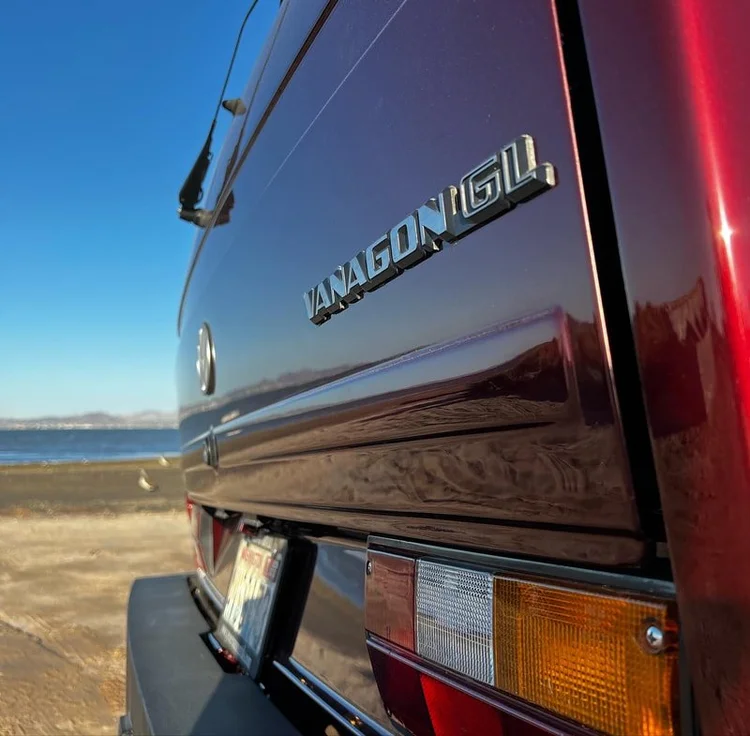 Volkswagen Westfalia badge on a burgundy rear hatch