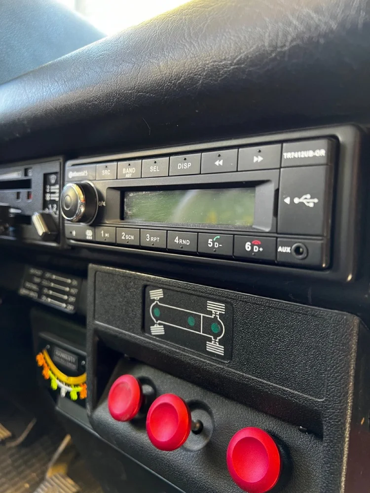 An aftermarket stereo integrated into the original dashboard layout.