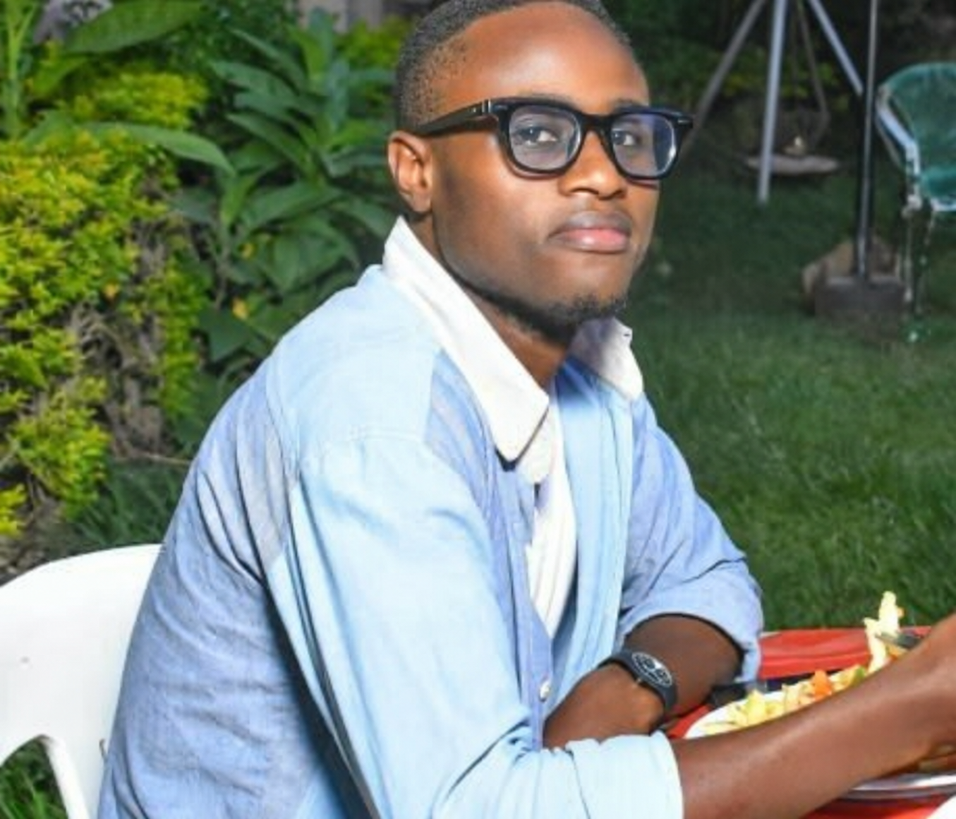 Ezron Kaijuka seated outdoors