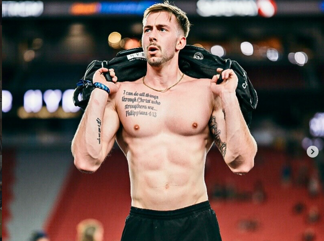 Stephen competing in HYROX with a sandbag