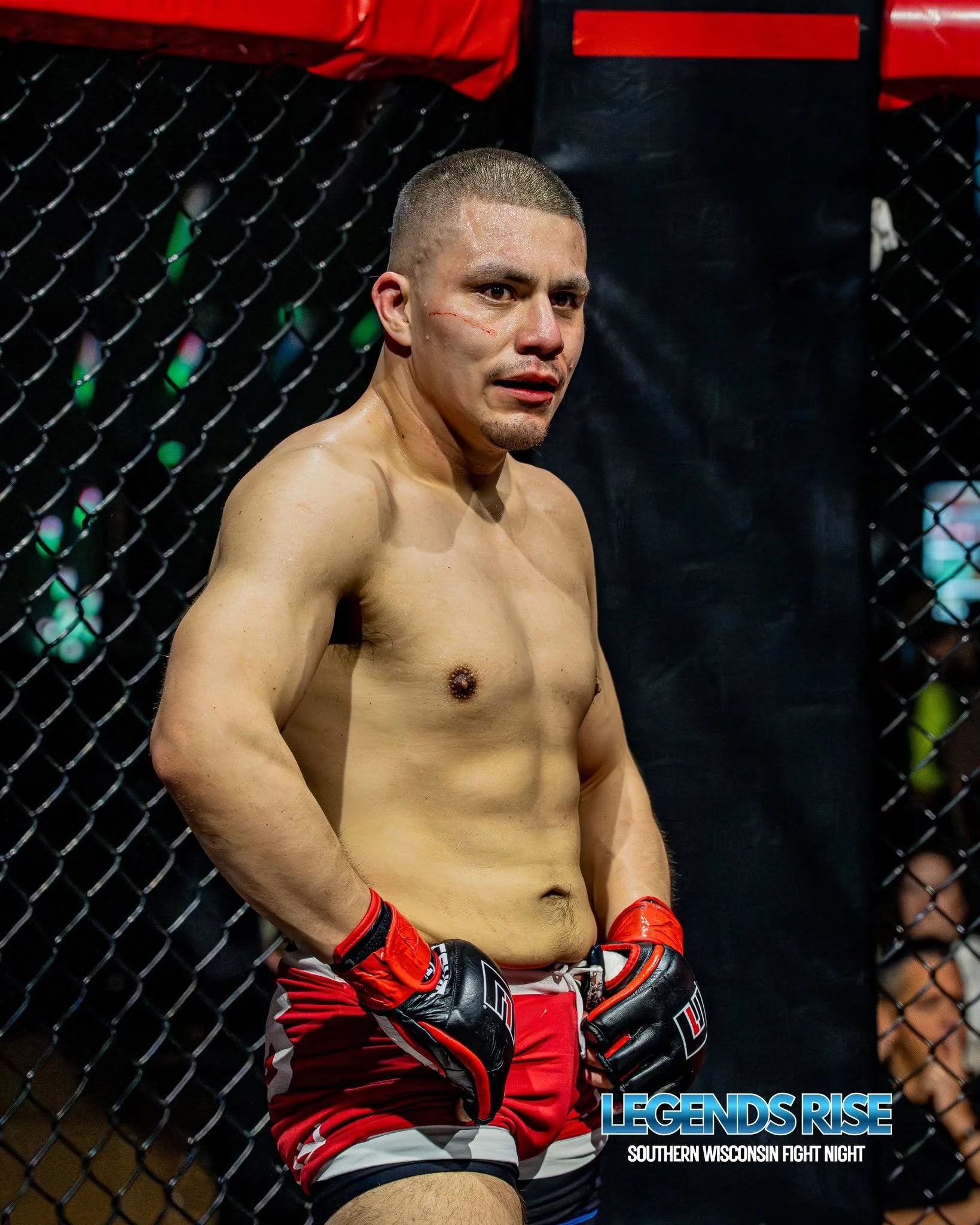 Uriel in the cage at a combat sports event