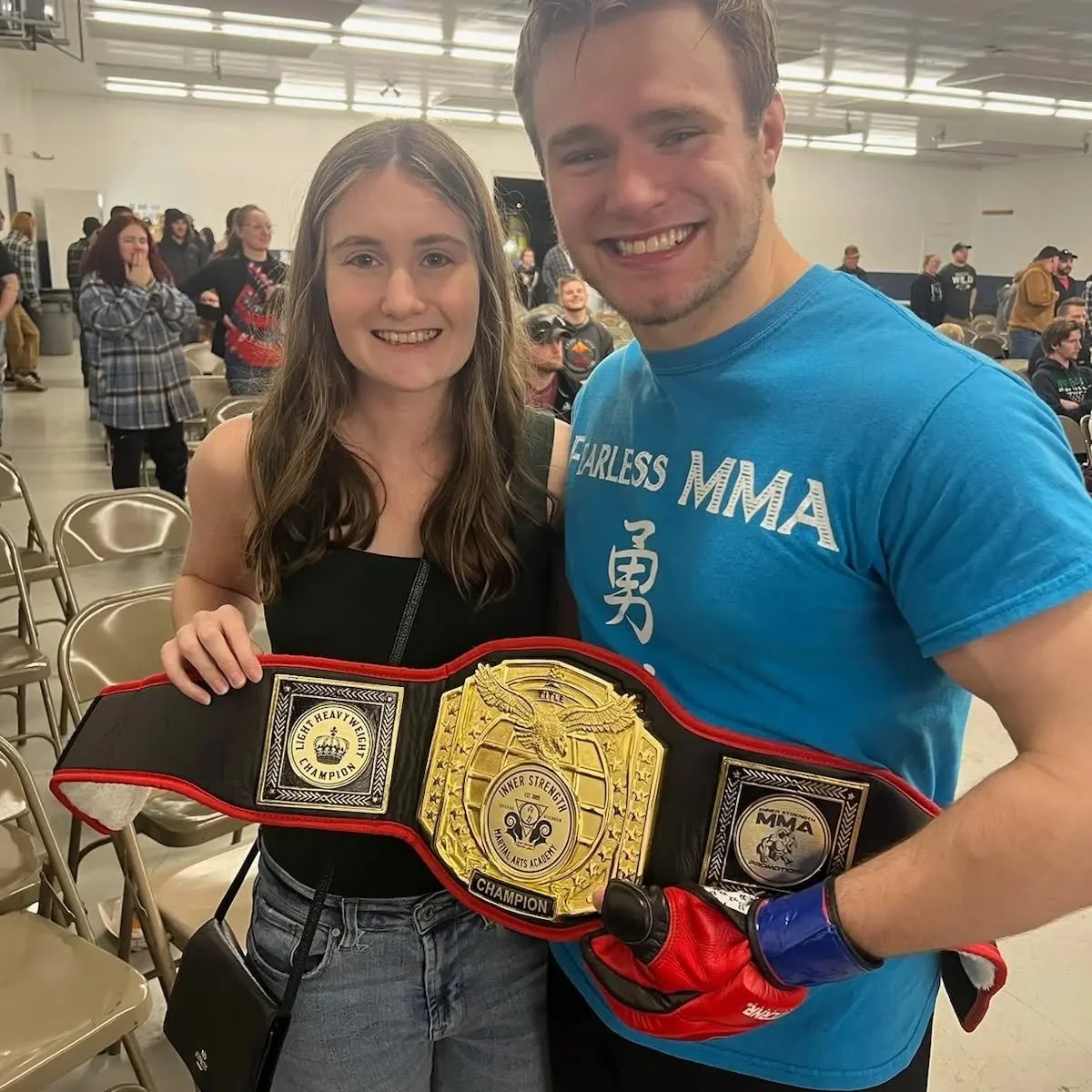 Colin holding his championship belt