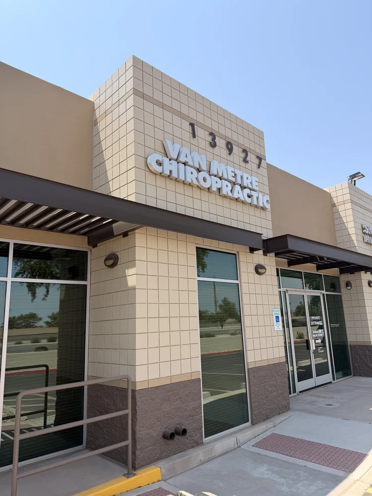 Van Metre Chiropractic building sign and street number 13927 on West Grand Avenue in Surprise.
