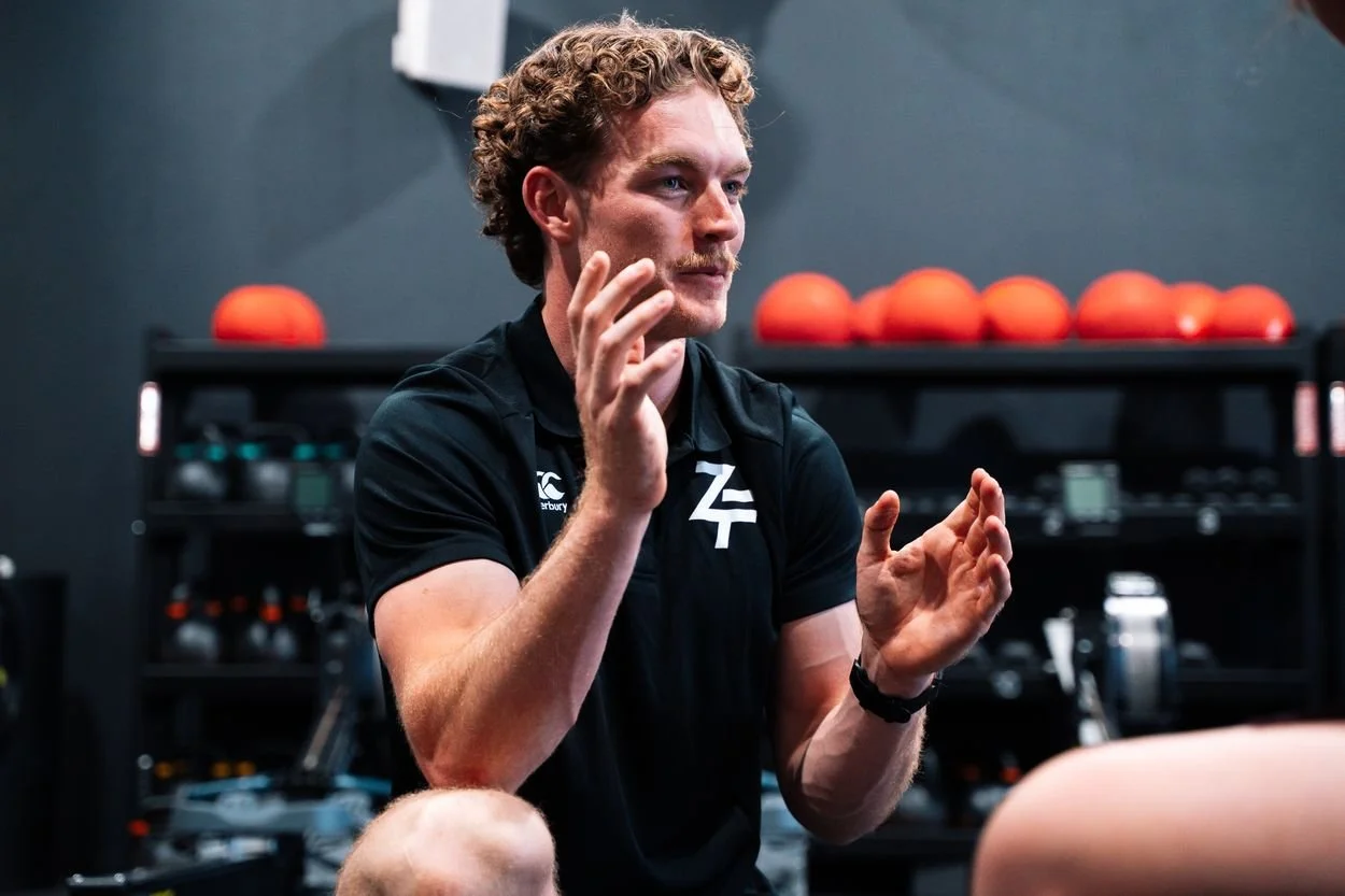 Zac Stannard coaching on the gym floor