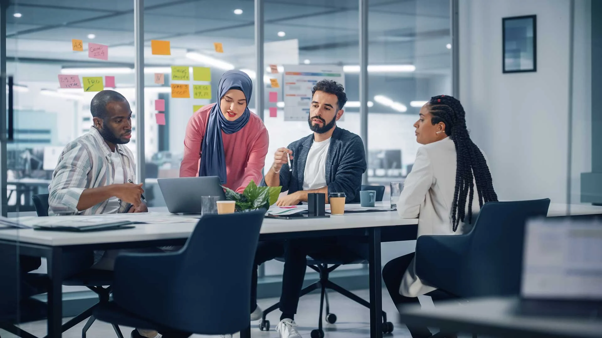 Colleagues sharing ideas around a meeting table