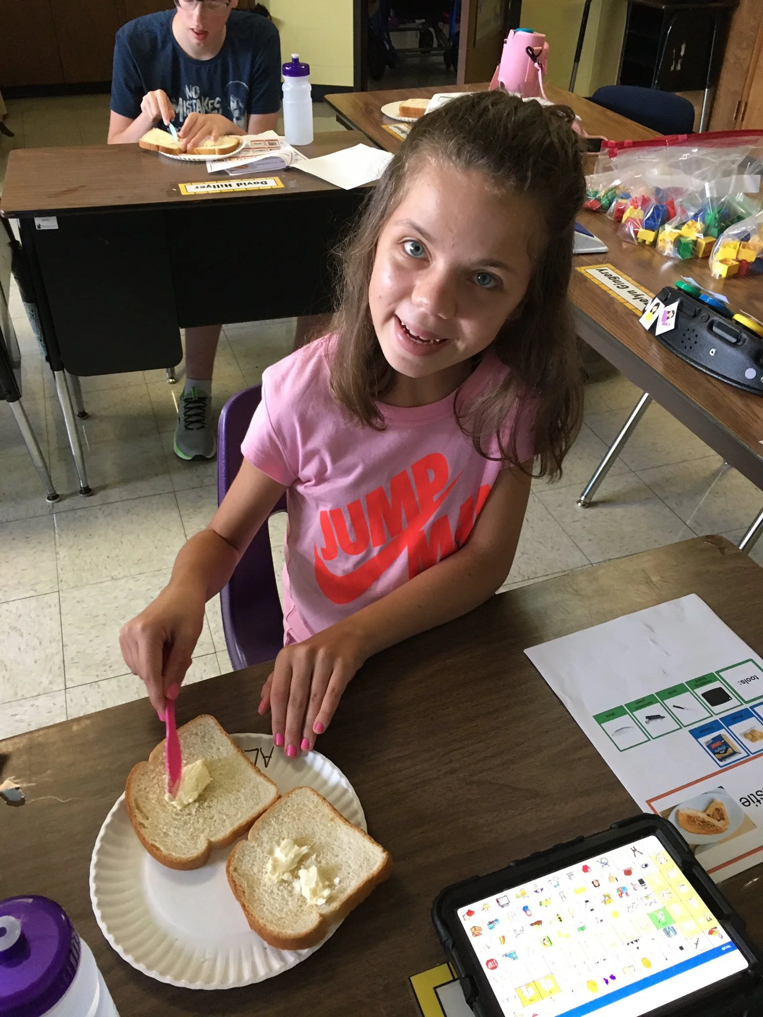 A Dale-Roy student practicing life skills — preparing a sandwich in a classroom activity that builds independence.