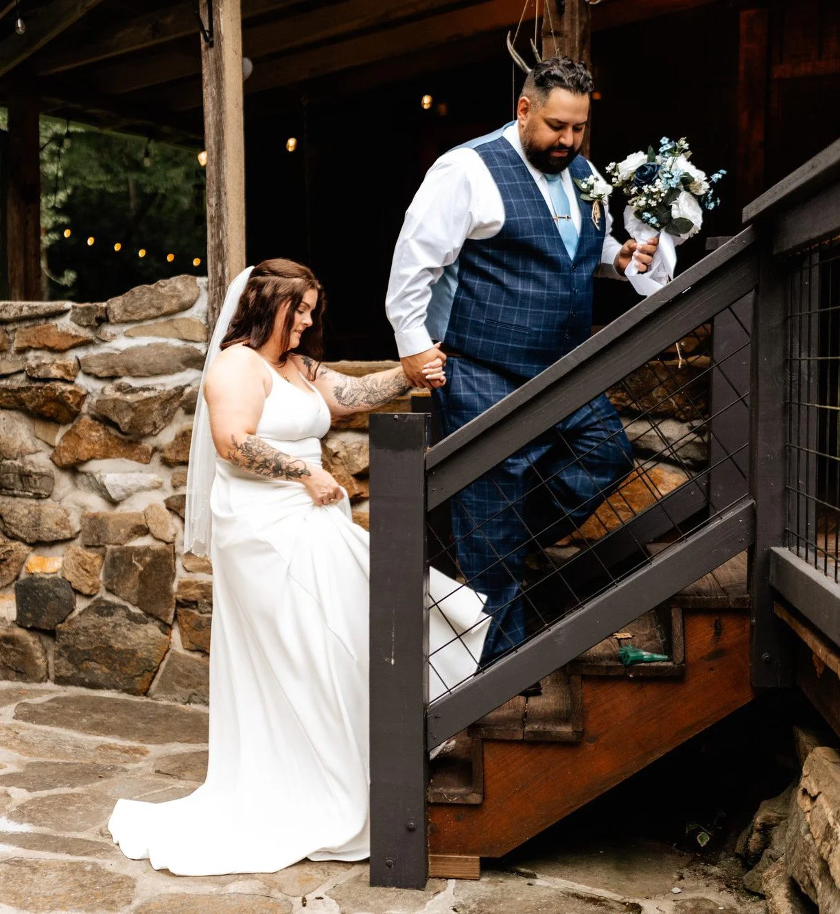 Blue Ridge wedding venue stairway, couple walking while holding hands