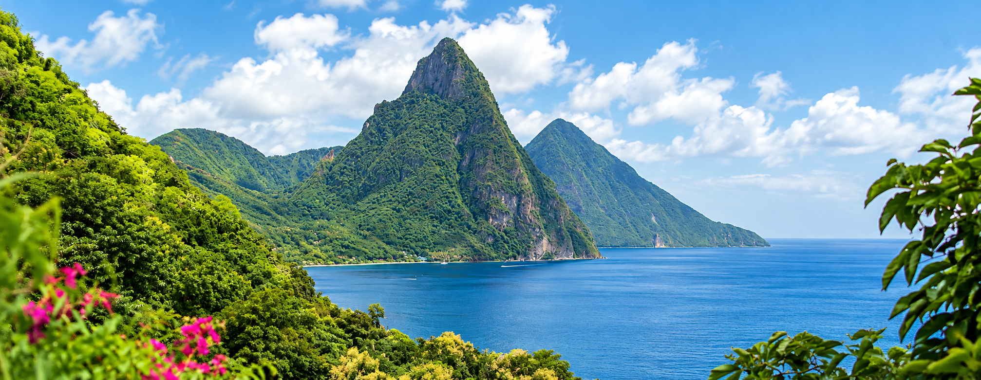 The Pitons rising above blue Caribbean waters in St. Lucia