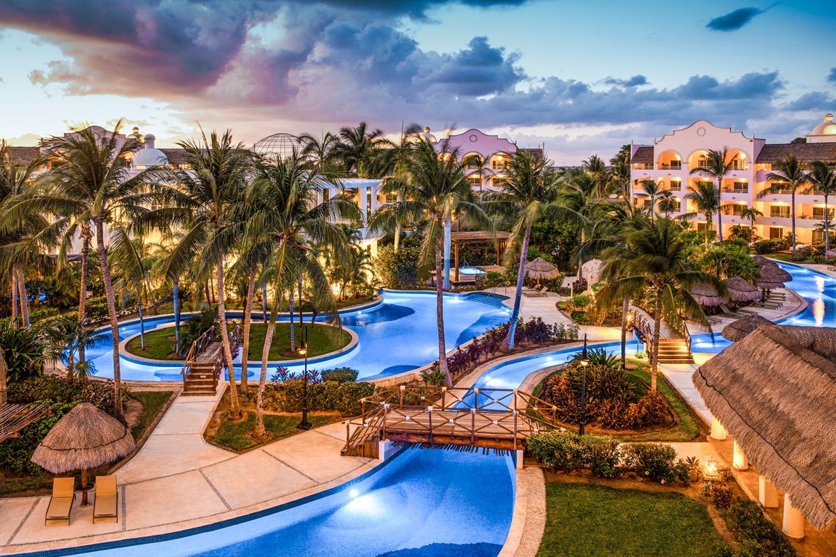 Pools and palm trees at Excellence Riviera Cancun