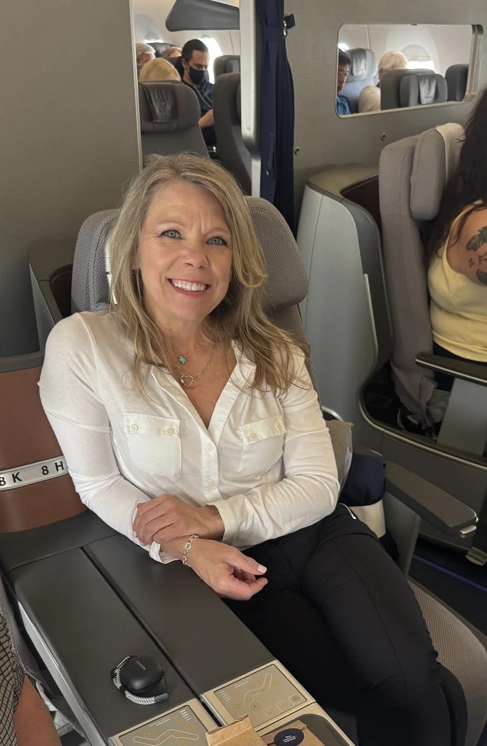 Sandy Campbell seated on an airplane