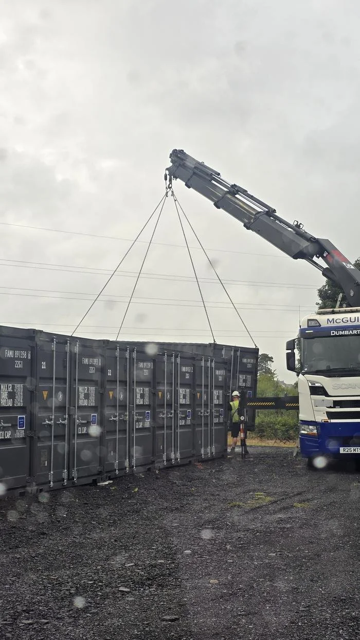 Containers being craned into position in the yard