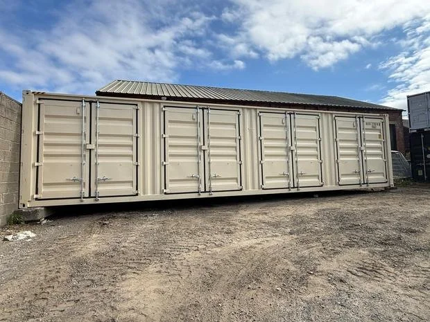 A 40ft container with four sets of side-opening doors, divided into individual 10ft units