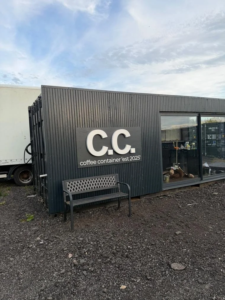 A container converted into a clad coffee shop with glazed frontage