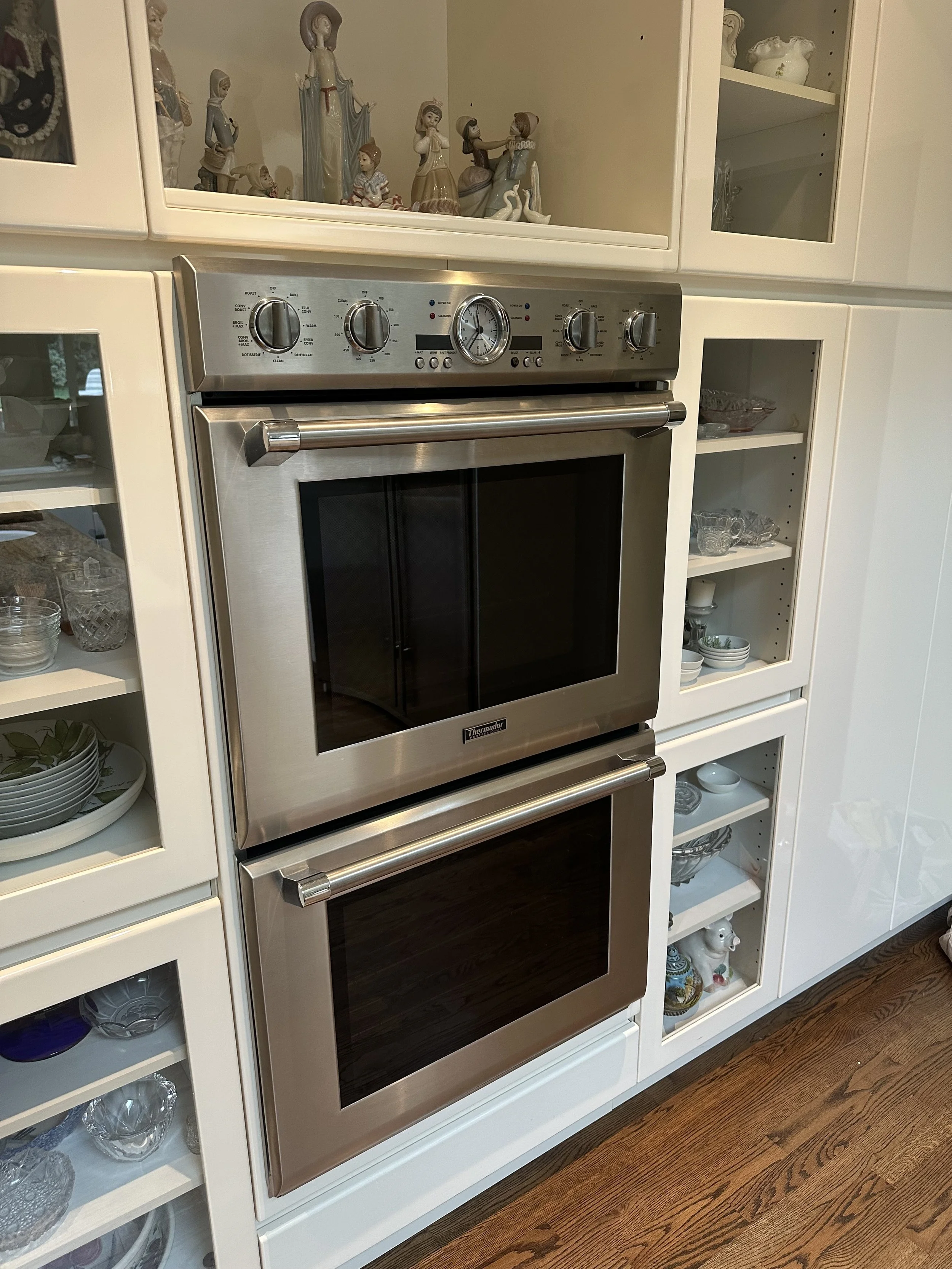 Technician repairing a Thermador double wall oven