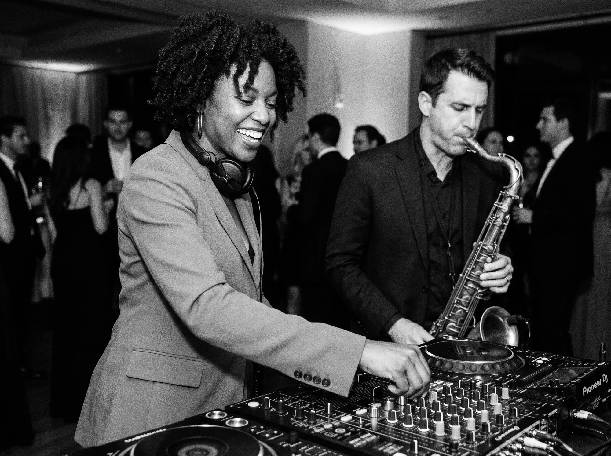 A DJ and saxophonist performing at a private event