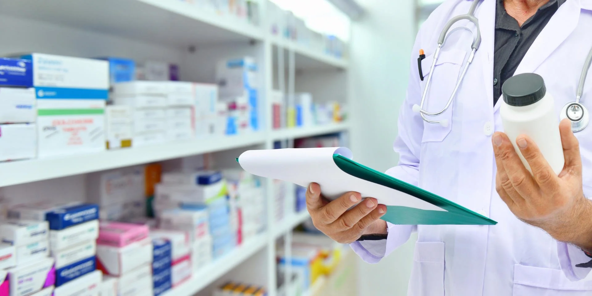 Pharmacist checking storage shelves