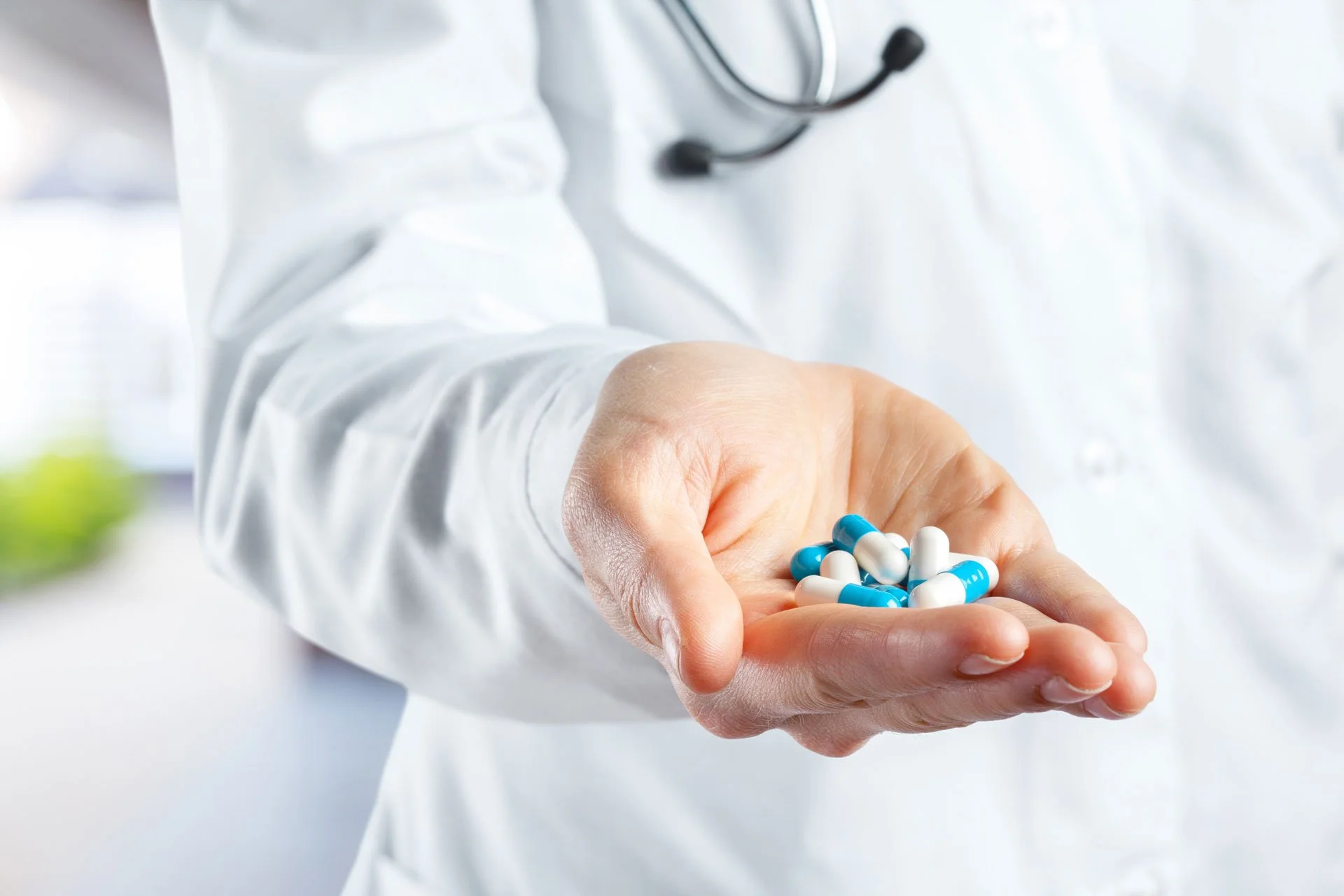 Hand holding pills