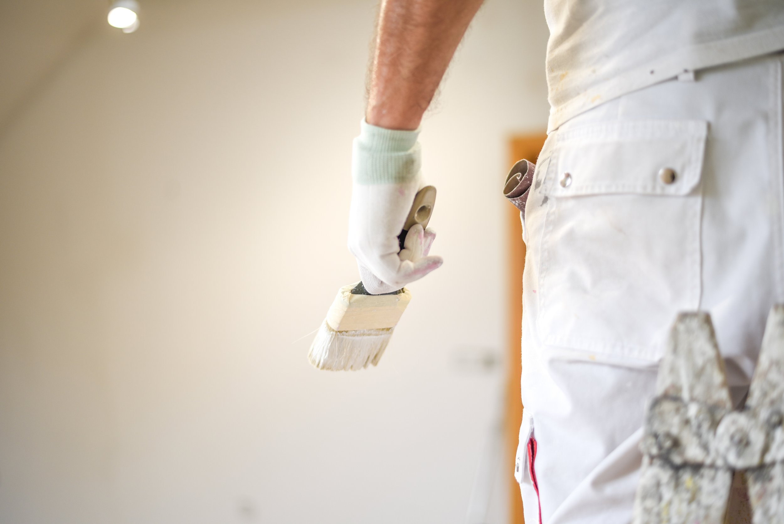 Craftsman holding a paint brush