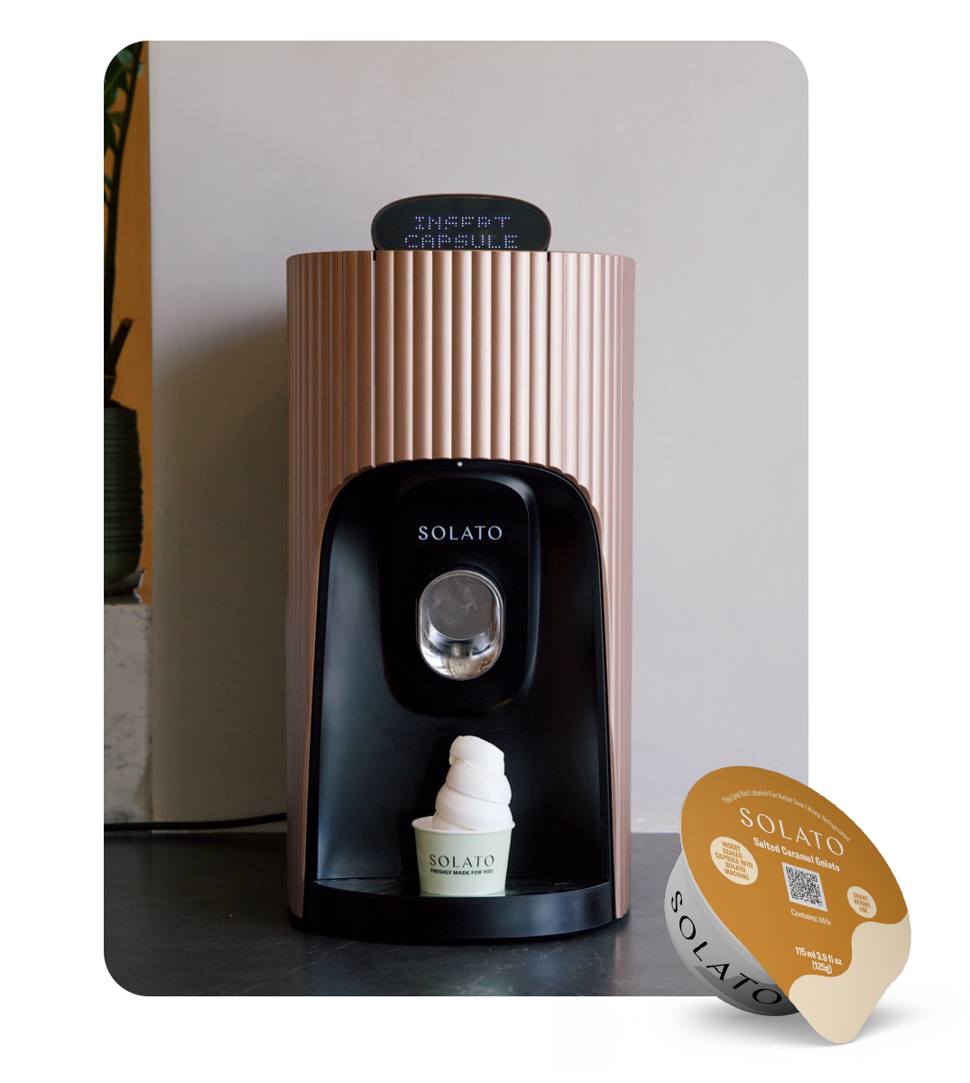 Official SOLATO product photograph of its gelato machine beside a serving of gelato