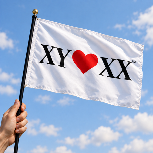 Parade Flag concept held by a hand against blue sky