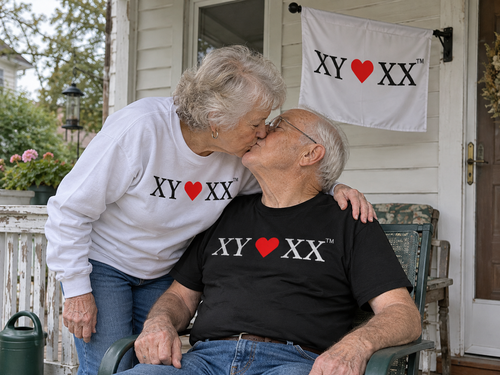 Older couple kissing on an ordinary porch beneath the Family Home Flag.
