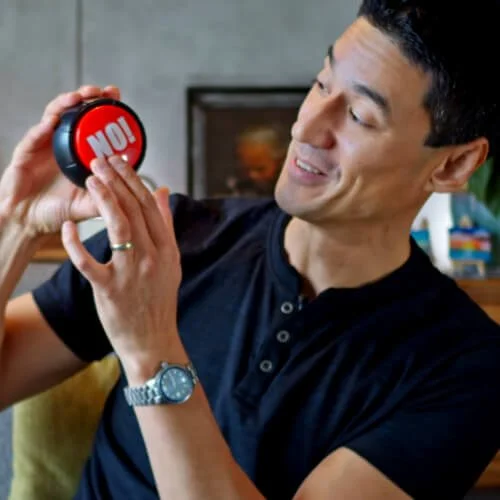 Daniel pointing to a red 'no' button, with text 'Saying no'