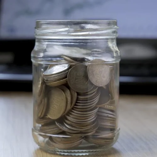Adding coins to a jar