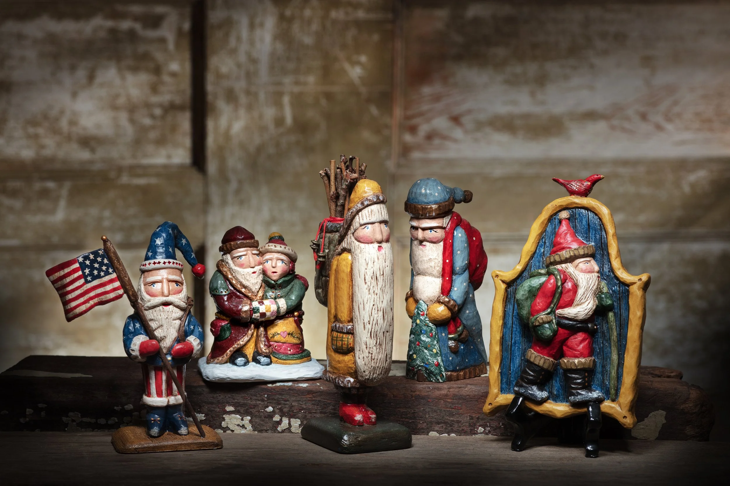 The five hand-painted Santa figures of the 2026 Navone Folk Art Collection