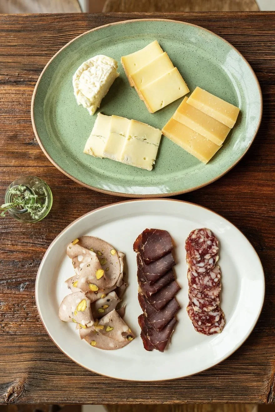 Green and white serving plates made for Merenda Wine