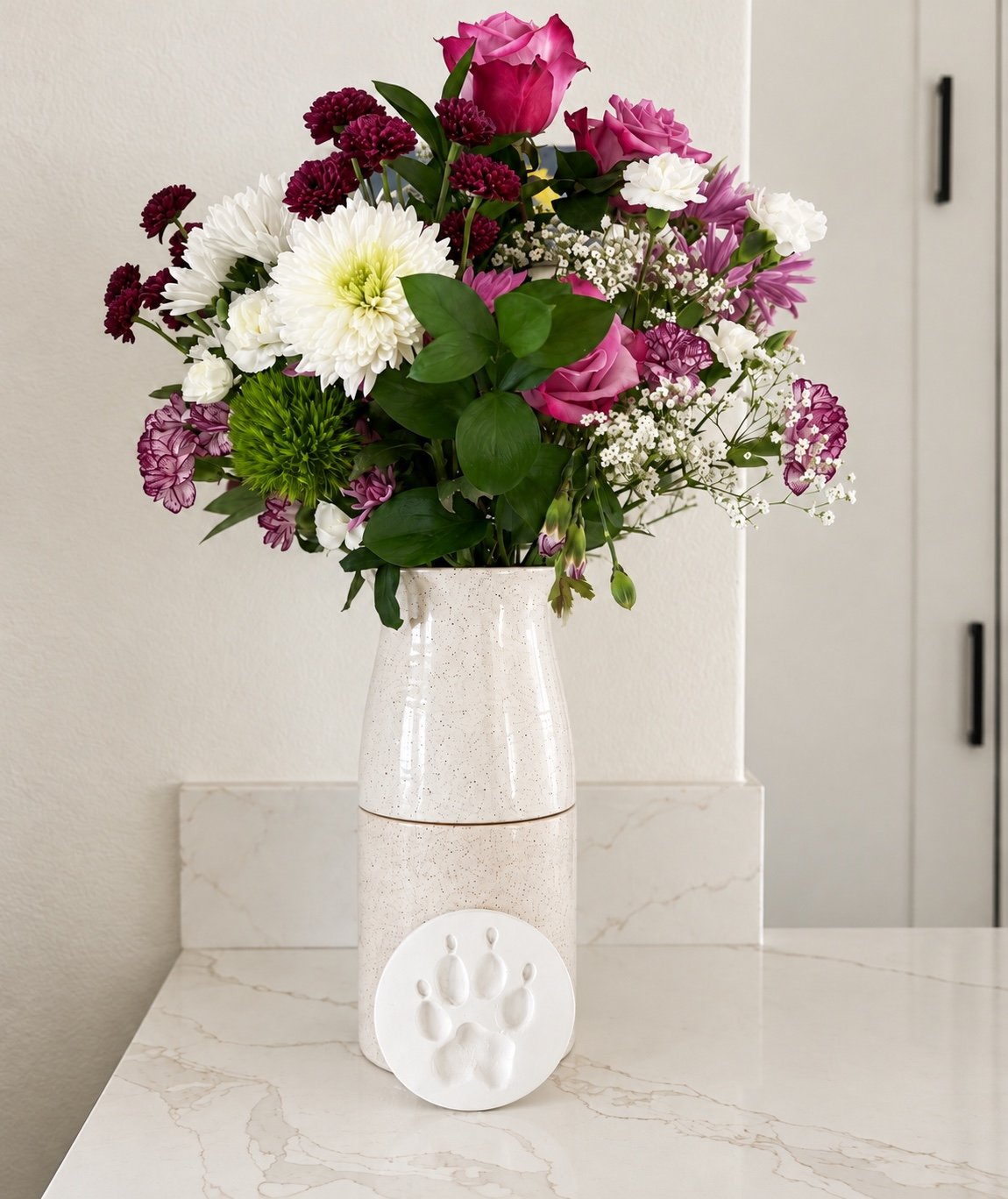 Two part white memorial vase with flowers and a paw print