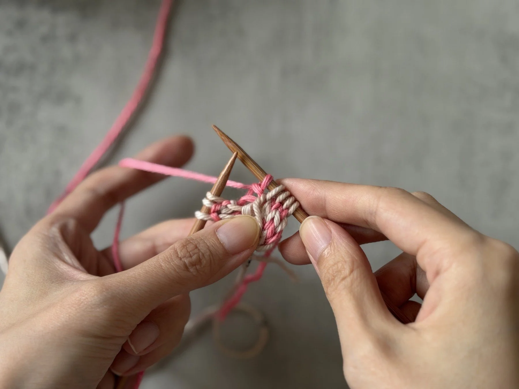 Side A facing the knitter, with the final three I-cord edge stitches still on the left needle.