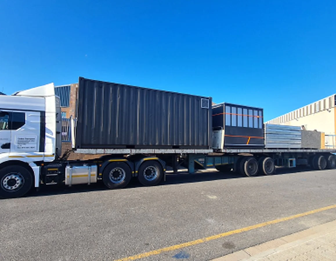 Malapa transport truck carrying lodge materials