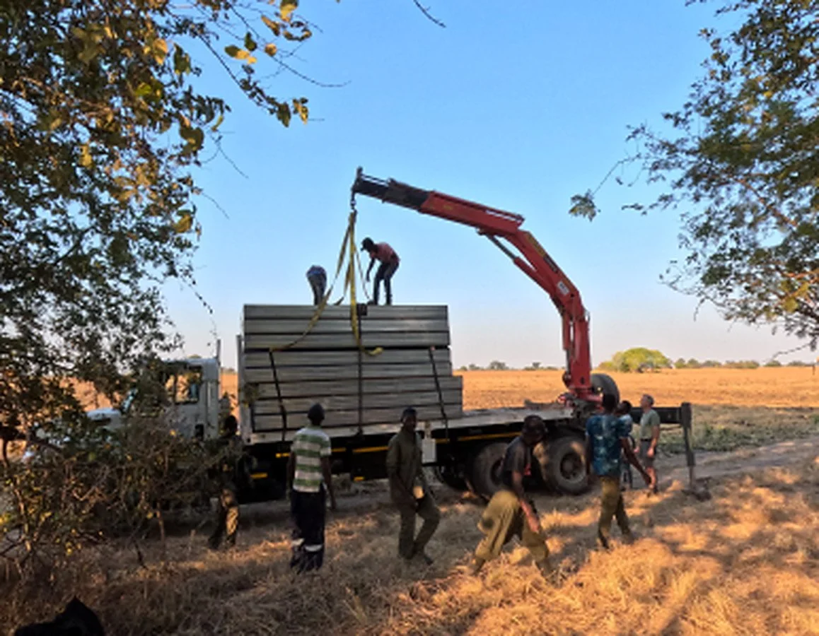 Crane unloading lodge construction materials